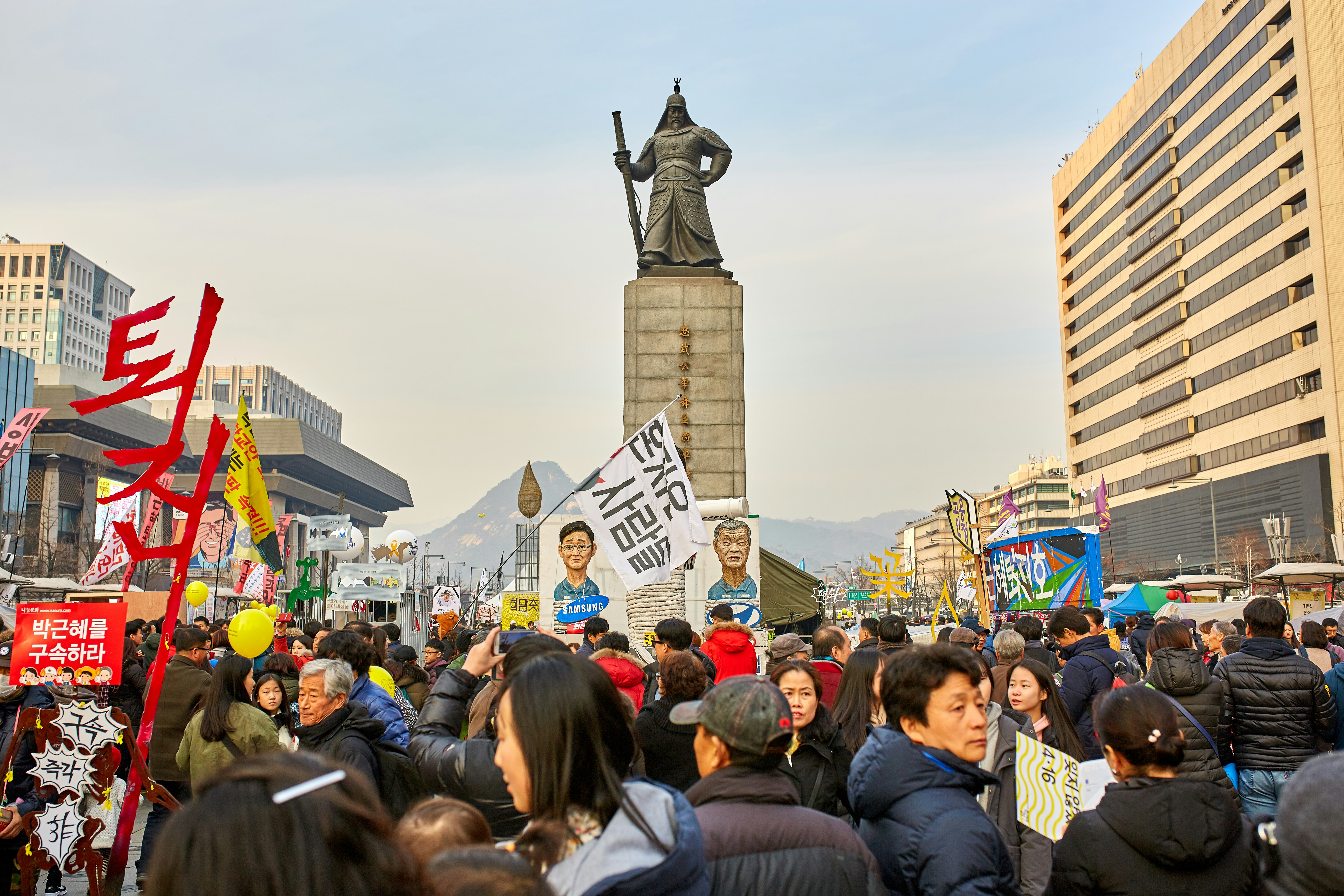 people near statue